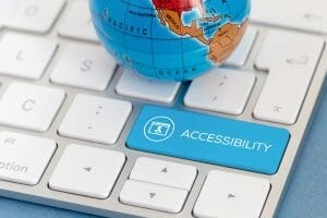 globe on keyboard with blue accessibility key
