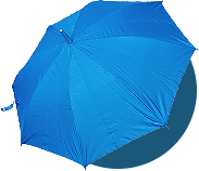 A fully opened blue umbrella is shown from above against a plain, light background with a slight shadow beneath it. The simple design, with visible fabric segments and a small handle, subtly evokes themes of accessibility and ADA Website Compliance.