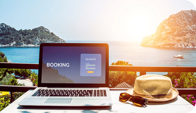 Laptop displaying a booking landing website with a background landscape of a big blue lake surrounded by mountains