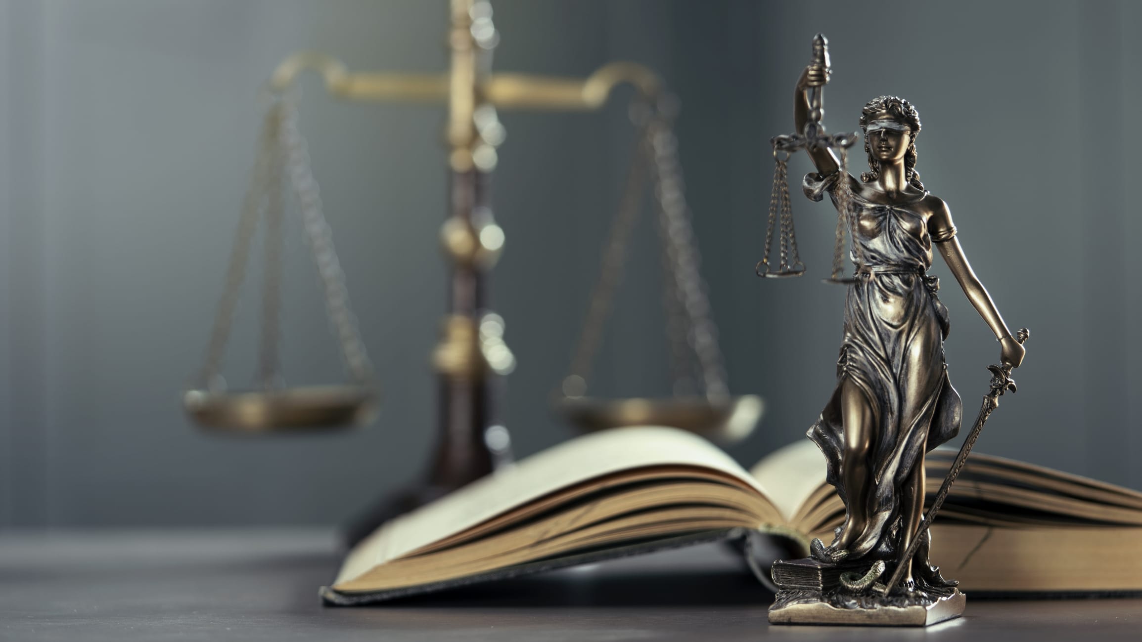 lady justice, open book and scales of justice